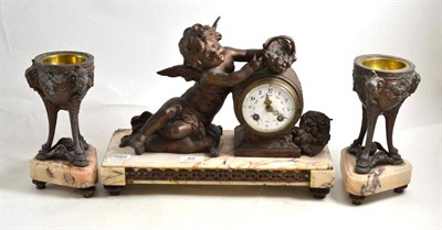 Lot 82 - A spelter and marble striking mantel clock with garniture, early 20th century, 28cm high, garniture
