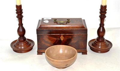 Lot 94 - A George III mahogany tea caddy, two turned candlesticks and a bowl