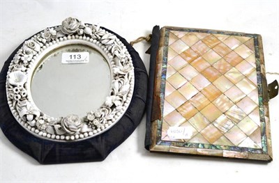 Lot 113 - Mother-of-pearl mounted blue silk lined blotter and a white porcelain floral encrusted oval...