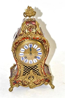 Lot 130 - A tortoiseshell and brass inlaid striking mantel clock, movement stamped Howell James & Cie, To the