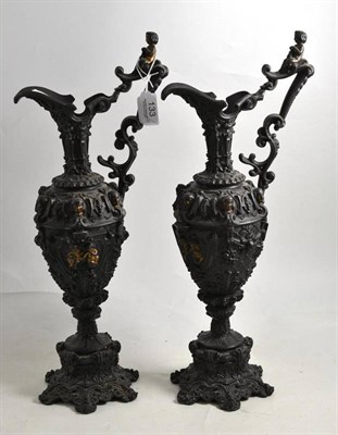 Lot 133 - A pair of Renaissance style cast iron ewers, 46cm high