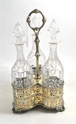 Lot 138 - Silver plated three bottle decanter carrier with three cut glass bottles