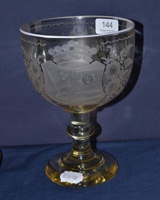 Lot 144 - An engraved armorial and dated glass, 14cm diameter