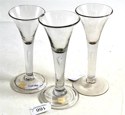 Lot 166 - Three 18th century trumpet and tear stem wine glasses