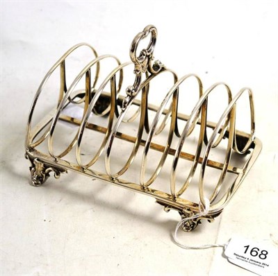 Lot 168 - A Victorian silver toast rack, London 1837, raised on scroll feet