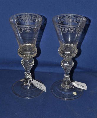 Lot 170 - A pair of 18th century engraved and cut wine glasses