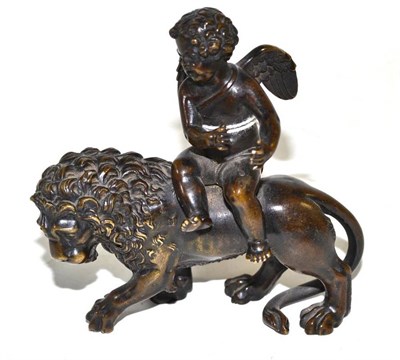 Lot 172 - Small bronze figure of a putto riding a lion