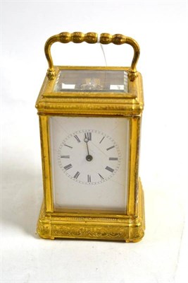 Lot 178 - A gilt brass engraved striking and repeating carriage clock, circa 1890, 16.5cm high over handle