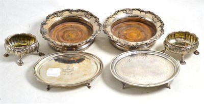 Lot 182 - Two silver teapot stands, a pair of silver plated bottle coasters and a pair of salts (a.f.) (6)