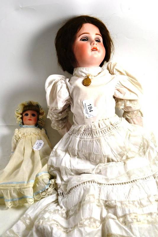 Lot 184 - A bisque headed SFBJ doll and a modern