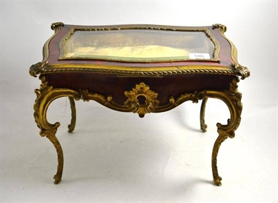 Lot 186 - A late 19th century Louis XV style ormolu mounted miniature bijouterie table with glazed hinged...