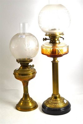 Lot 187 - Two brass oil lamps