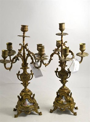 Lot 204 - A pair of gilt metal candelabra, 44cm high