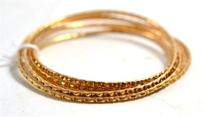 Lot 220 - Six patterned bangles, four stamped '15'