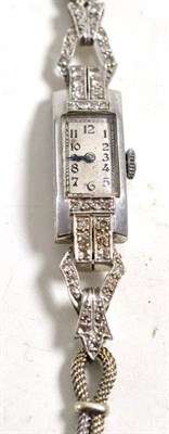 Lot 234 - An Art Deco lady's wristwatch, set with eight-cut diamonds, on a 9 carat white gold rope link...