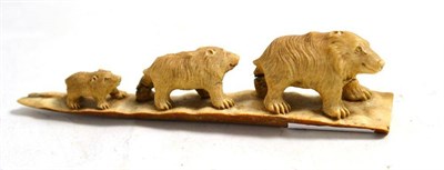 Lot 238 - An interesting carved ivory figure group of three graduated animals, base 12cm long