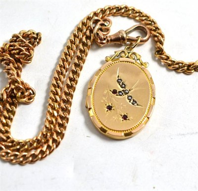 Lot 244 - A 9ct gold ruby and seed pearl set locket on a curb link Albert chain, stamped every link...