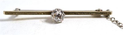 Lot 249 - A diamond bar brooch, an old cut diamond to the centre of an engraved bar, estimated diamond weight