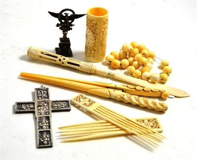 Lot 262 - A Continental white metal cross and a seal, a pair of Japanese ivory hair combs, ivory beads, ivory