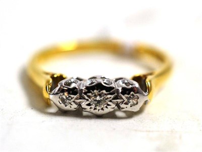 Lot 265 - An 18ct gold diamond three stone ring, diamonds in illusion settings, finger size K1/2