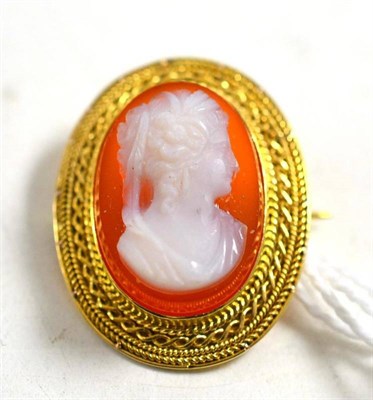 Lot 268 - A cornelian cameo brooch in a rope twist frame, measures 2cm by 2.5cm