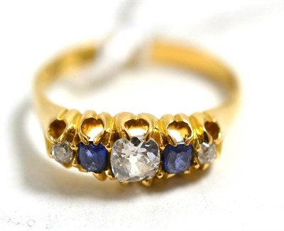 Lot 271 - An 18ct gold diamond and sapphire five stone ring, with three old cut diamonds, total estimated...