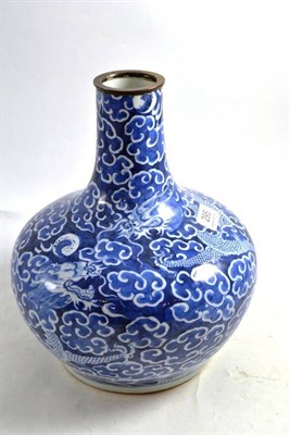 Lot 295 - A Chinese porcelain bottle vase, 18th century, painted in underglaze blue with dragons chasing...