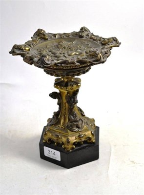 Lot 314 - A bronze and gilt metal decorative stand, cast with mermaids and winged cherubs playing...