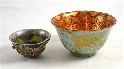 Lot 315 - A Chinese celadon, gilt and iron red bowl, Kinrande style, internally centred by a kylin flanked by