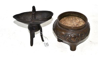 Lot 323 - A Chinese bronze tripod censer, early 20th century, worked with three dragons, 10.5cm high; and...