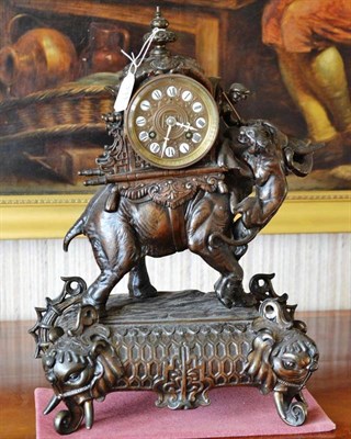 Lot 331 - A bronzed metal striking mantel clock, depicting an elephant, 44cm high