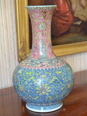 Lot 332 - A Chinese porcelain vase, 19th century, richly enamelled with stylised lotus and dragon leaf...