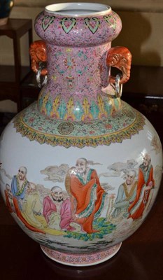 Lot 333 - A Chinese porcelain famille rose large vase, 20th century, with elephant head and ring handles,...