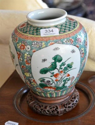 Lot 334 - A Chinese famille verte porcelain ovoid vase, early 20th century, decorated with four panels of...