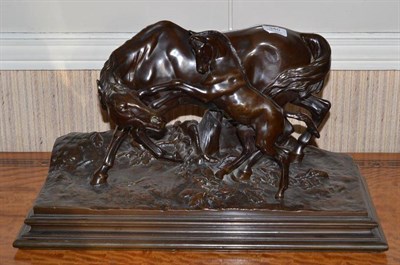 Lot 340 - A copper coated bronze group of a mare and foal, 56cm wide at base