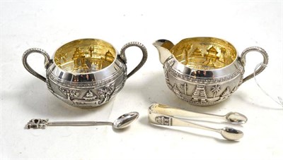 Lot 360 - P Orr & Sons, Madrass silver sugar basin and cream jug and matching tongs, and a white metal spoon