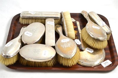 Lot 375 - Three piece dressing table set, six further brushes, a comb and a hand mirror