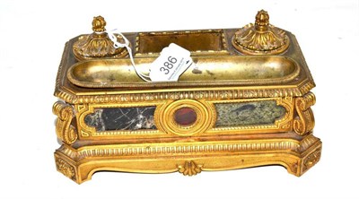 Lot 386 - A hardstone mounted ormolu encrier, probably French, 19th century, of canted rectangular form...