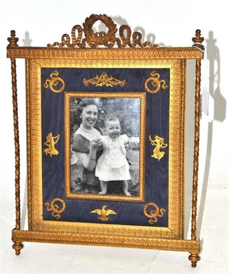 Lot 390 - A French gilt metal Empire style photograph frame, 34cm high