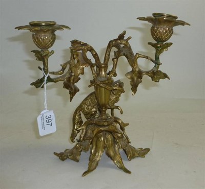 Lot 397 - A 19th Century gilt metal two branch candelabra surmounted with a dog, height 21cm