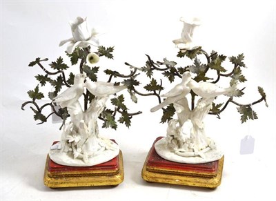 Lot 405 - A pair of Bow and metal white porcelain candlestick groups and stands (a.f.), 25cm high