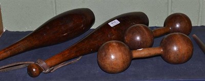 Lot 414 - Pair of treen dumbbells and a pair of 19th century strengthening weights in the form of skittles