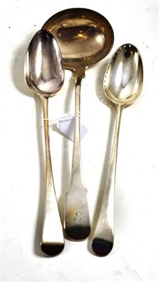 Lot 473 - A George III silver basting/straining spoon, London 1778, another London 1802 and a soup ladle,...