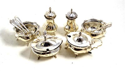 Lot 484 - A silver condiment set comprising two pepper casters, two salts, two mustard pots, two salt...