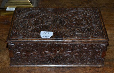 Lot 502 - An oak carved box, 32cm wide