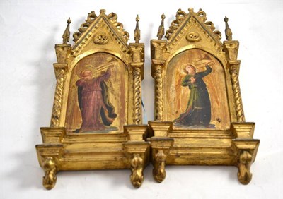 Lot 508 - A pair of giltwood religious icons each with a painted panel, 50cm high