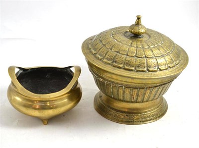 Lot 512 - A Chinese bronze squat circular censer with cast inscription to base, 14.5cm; and an Oriental brass