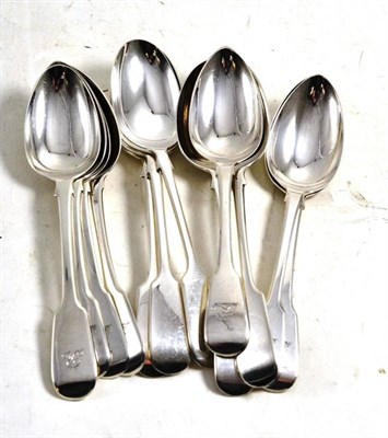 Lot 555 - A set of six George III silver fiddle pattern dessert spoons engraved with a crest, London...