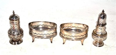 Lot 558 - Two Georgian silver casters and a pair of salts (lacking liners) London 1912