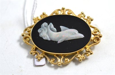 Lot 581 - A 9ct gold onyx and opal dolphin brooch, measures 5cm by 4cm